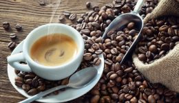 cup-of-espresso-with-coffee-beans-picture-id1177900338